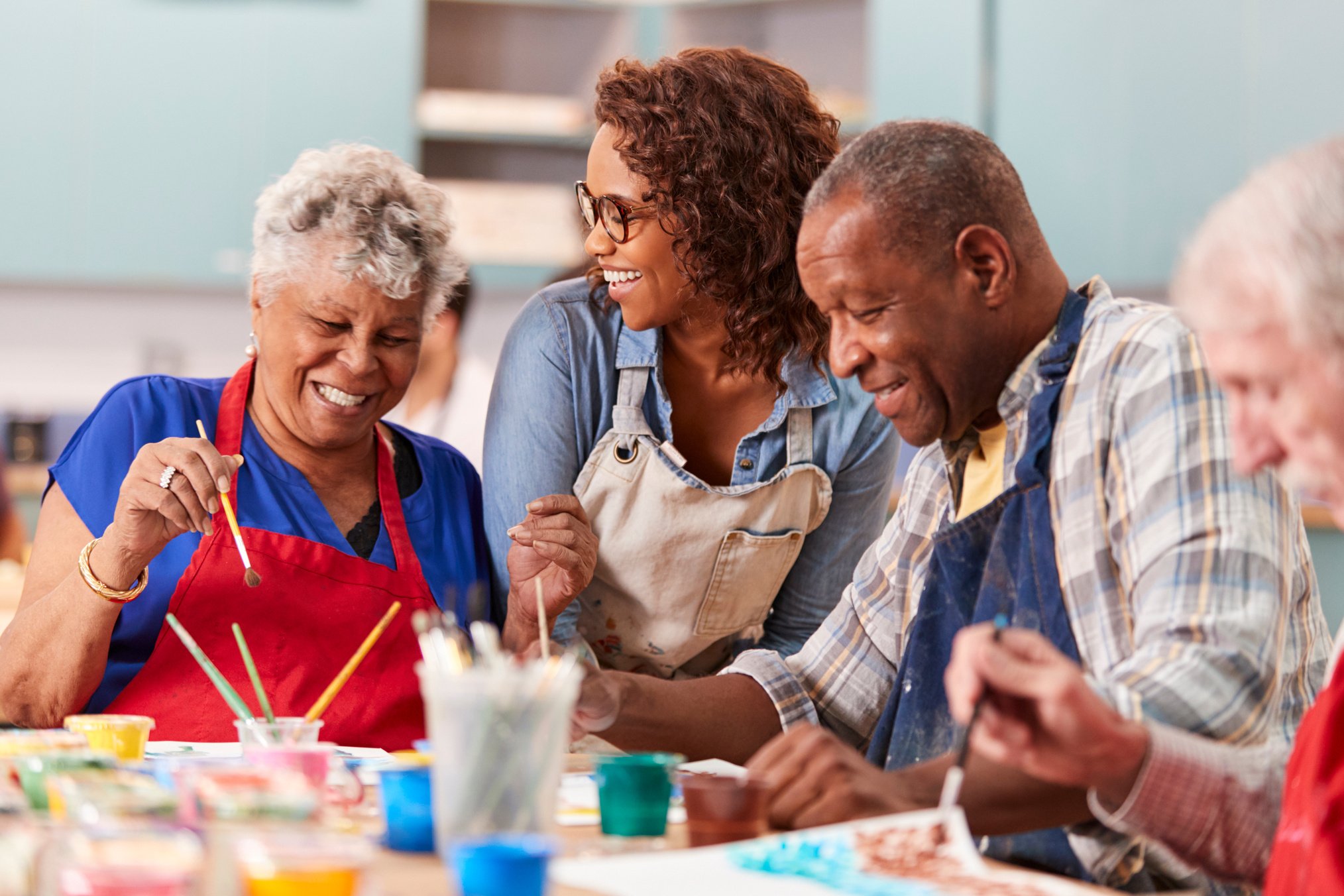 Group of Retired Seniors Attending Art Class in Community Centre